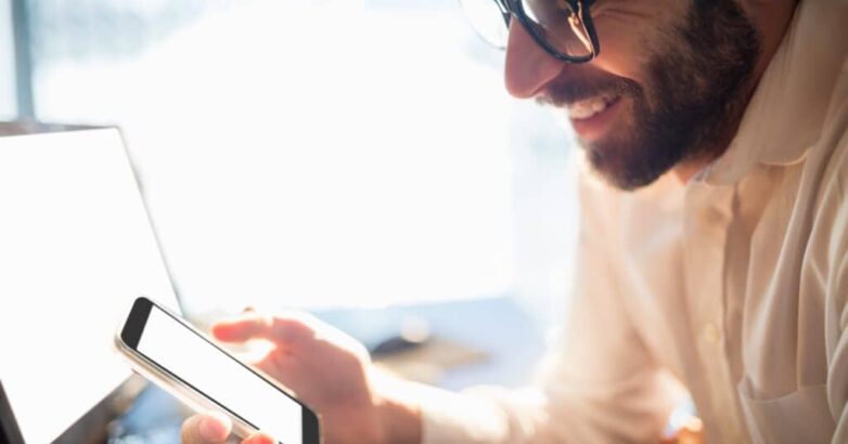 Businessman working and looking his phone