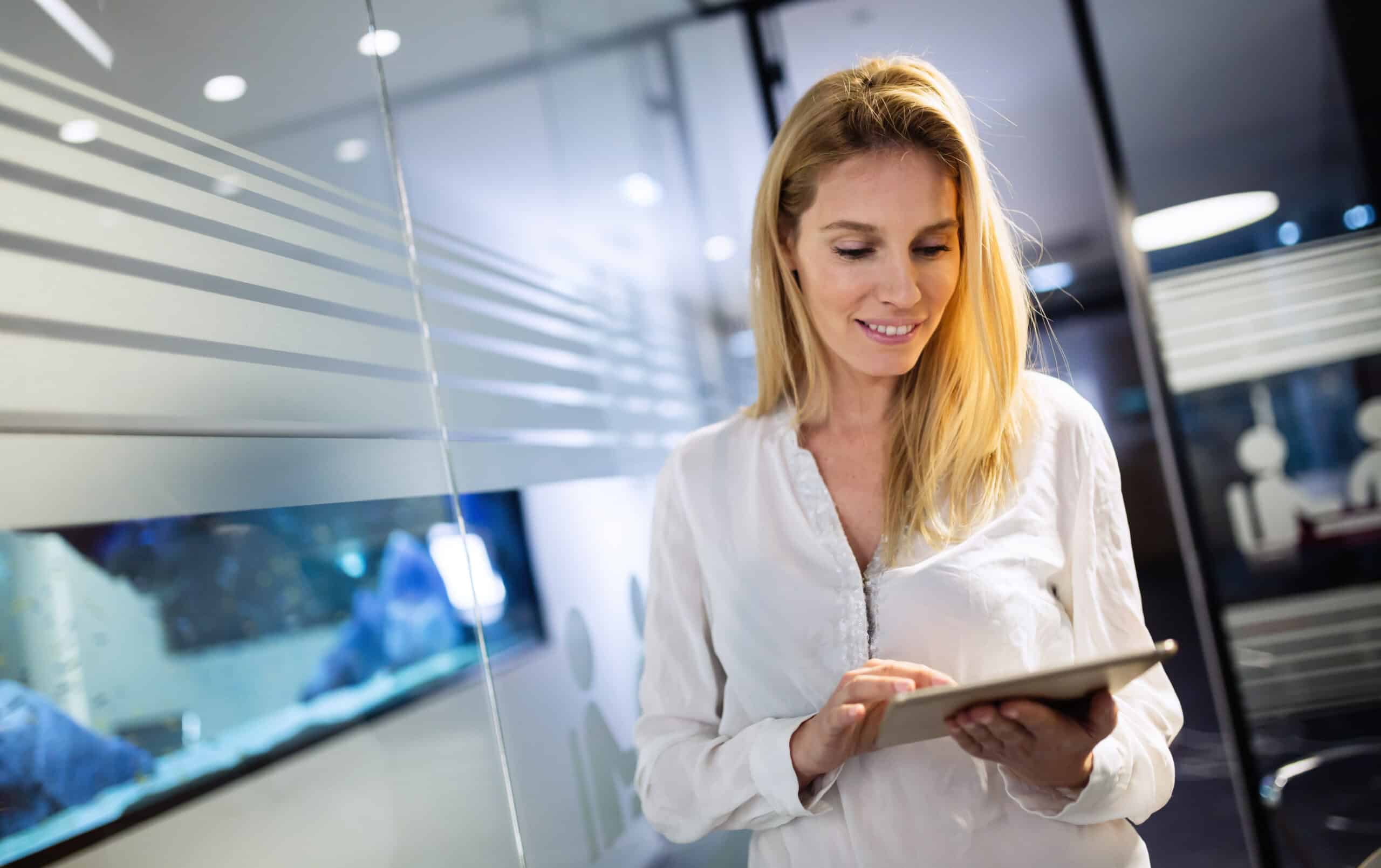 Businesswoman using tablet at information technology office