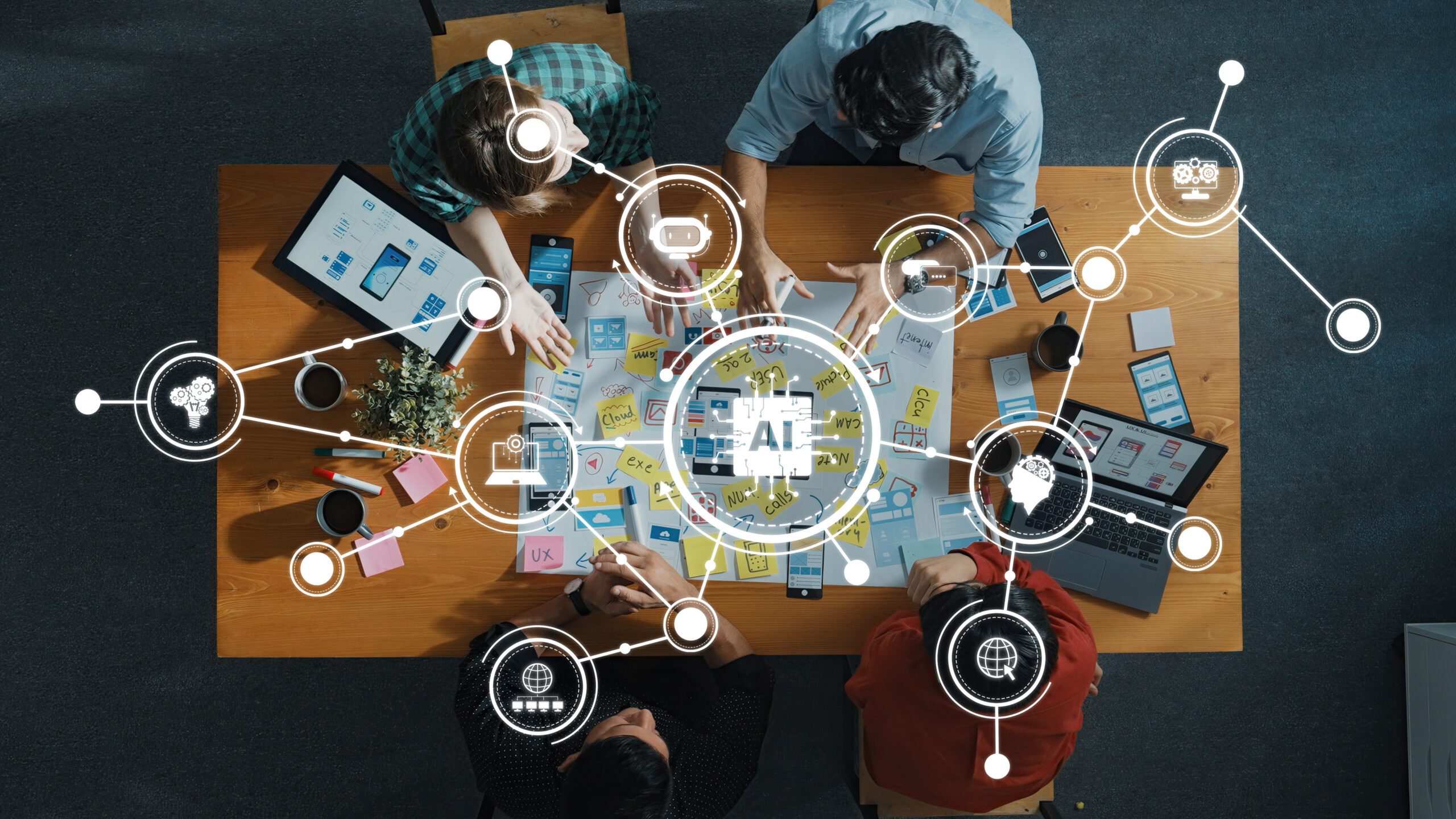 Collaborative Team Workshop Focused on AI Technology Development with Digital Tools and Ideas on a Wooden Table. Amity